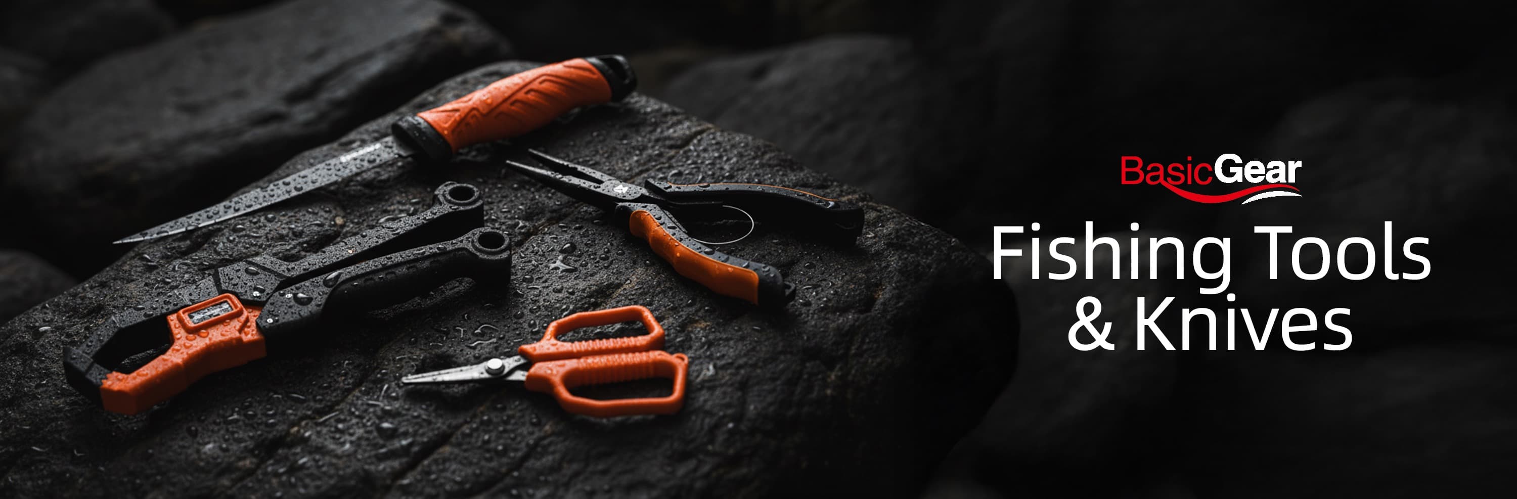BasicGear fishing tools and knives laid out on wet rock